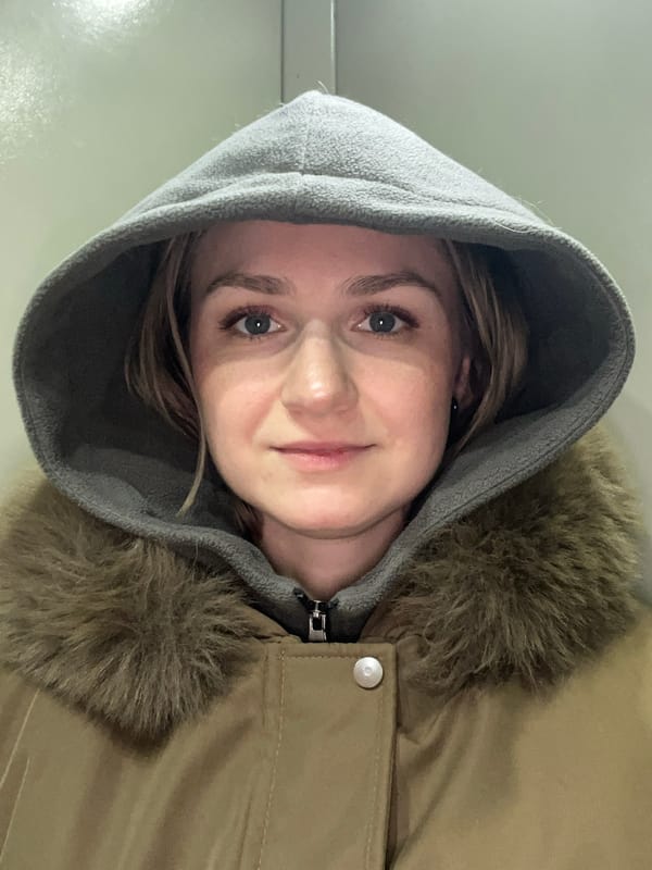 Morning portraits captured in Novosibirsk home show woman, resting Corgi