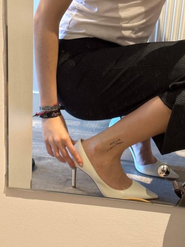 Person trying on shoes, taking selfies in Hull