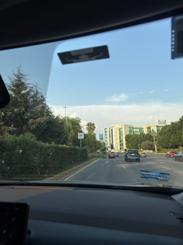 Evening traffic observed on multi-lane street in Puebla, Mexico