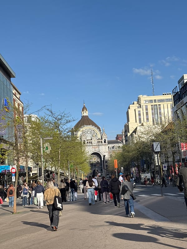 Pedestrians enjoy sunny afternoon on Antwerp boulevard