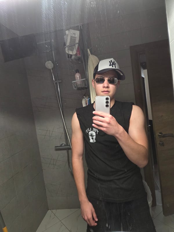 Person takes bathroom selfie in Sofia wearing casual attire