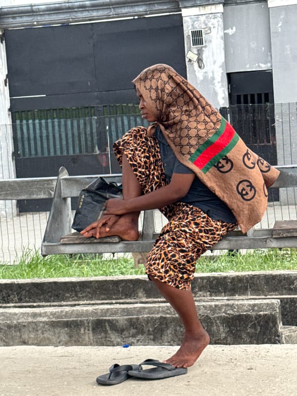Person rests on metal structure in Igboefon, Nigeria