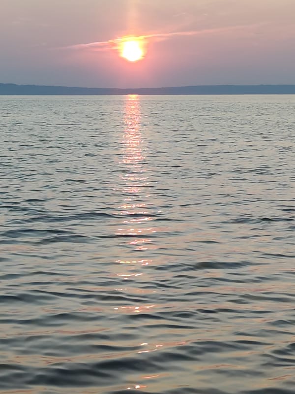 Kama River sunset glows orange over Chaikovsky, Russia