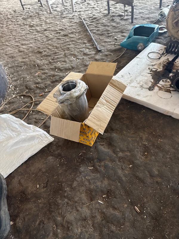Men work on mechanical repairs in Sarnevo workshop
