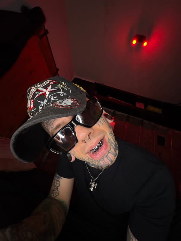 Heavily tattooed person documented in Buenos Aires residential settings