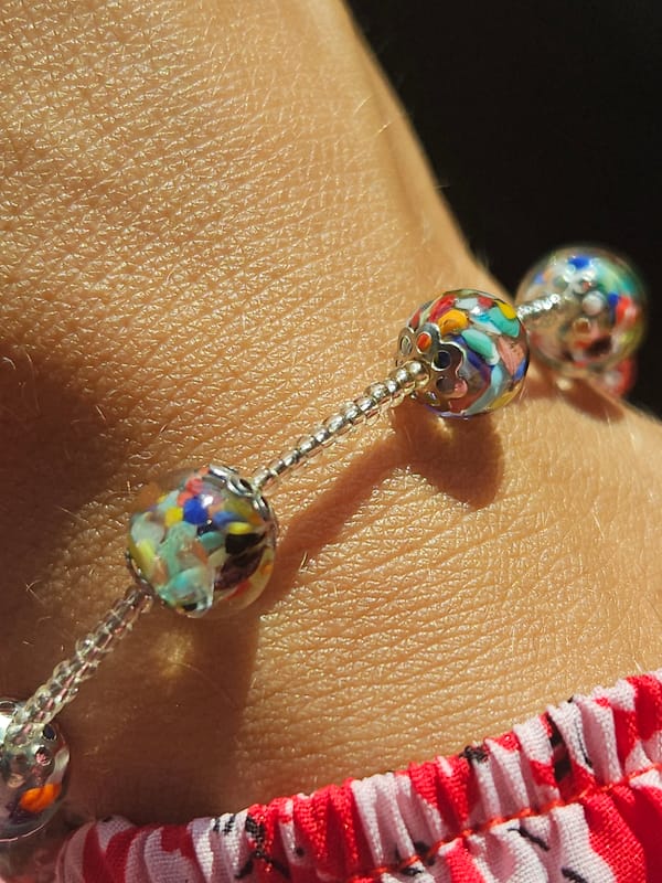 Berry-topped pastries and a beaded bracelet in Podgorica