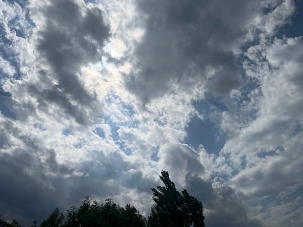 Witness documents changing skies and urban courtyard over one hour