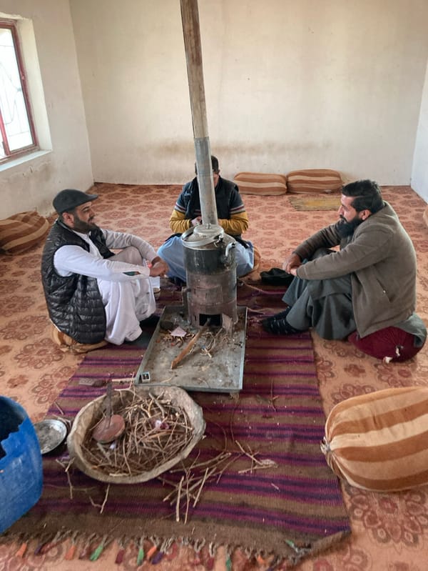Winter gathering scenes with stoves, parakeets captured across Pakistan