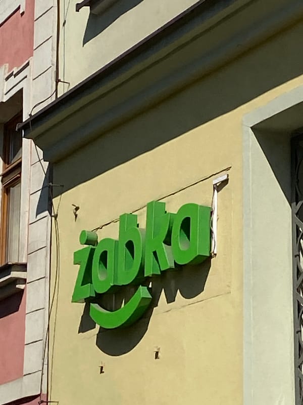 Tourist documents historic Wrocław Old Town shops and sculptures