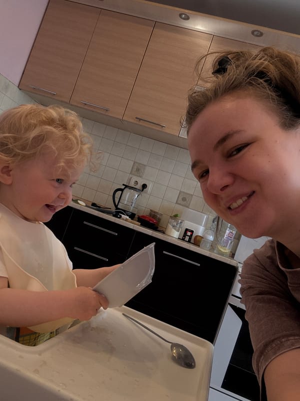 Morning mealtime captured between mother and toddler in kitchen