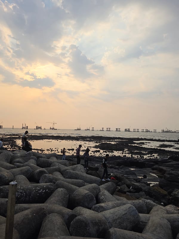 Mumbai coastline documented during midday golden hour sunset