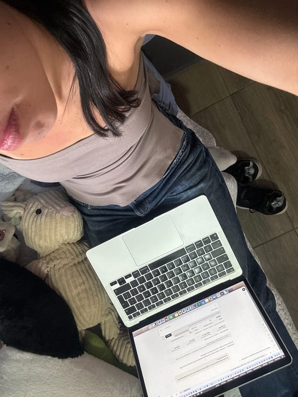 Person takes selfie while using laptop, April 8