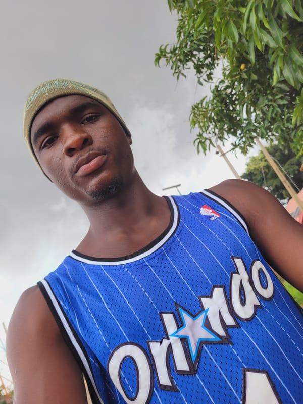 Young man documents morning in Nigerian towns wearing Orlando jersey