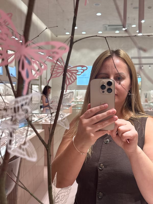 Trying on jewelry at a Prague boutique