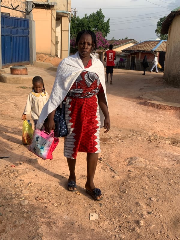 Daily life unfolds on Jos streets during evening hours