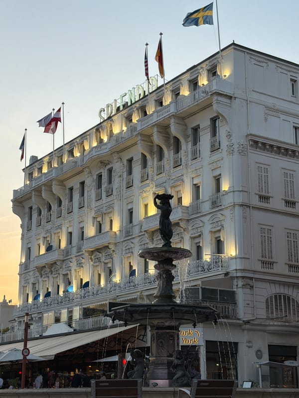 Evening stroll through Cannes captures hotels, fountains, restaurants
