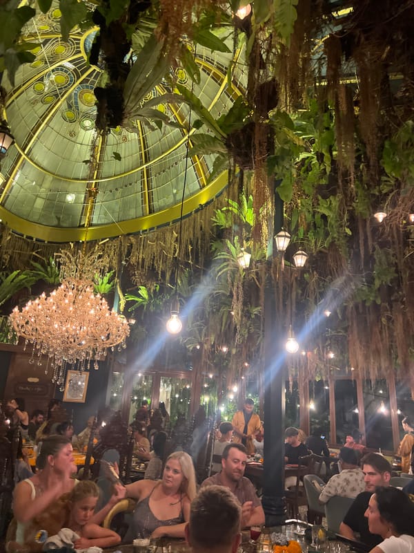 Restaurant interior with ornate glass dome ceiling documented in Ubud