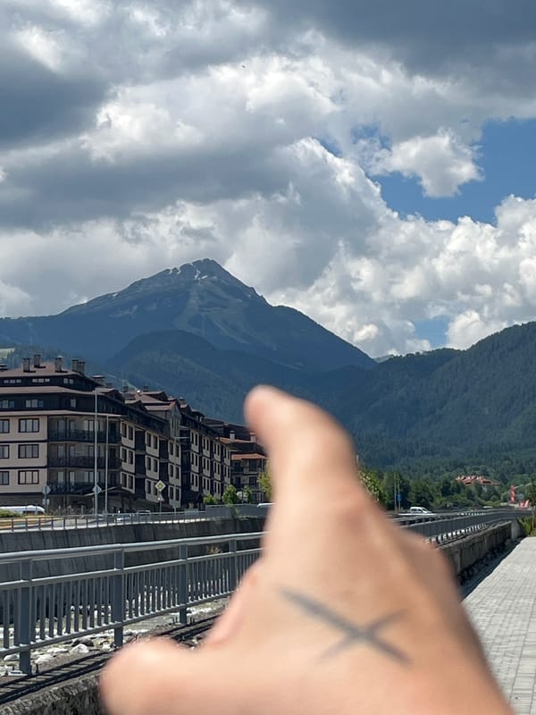 Pirin Mountains rising over Bansko on a cloudy summer morning