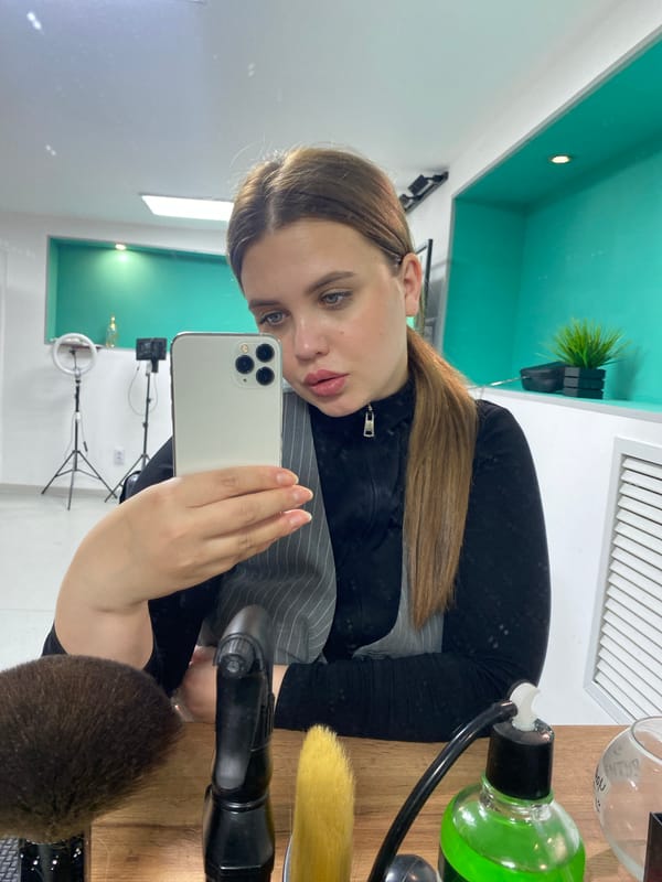 Woman takes selfie at modern hair salon in Chernushka
