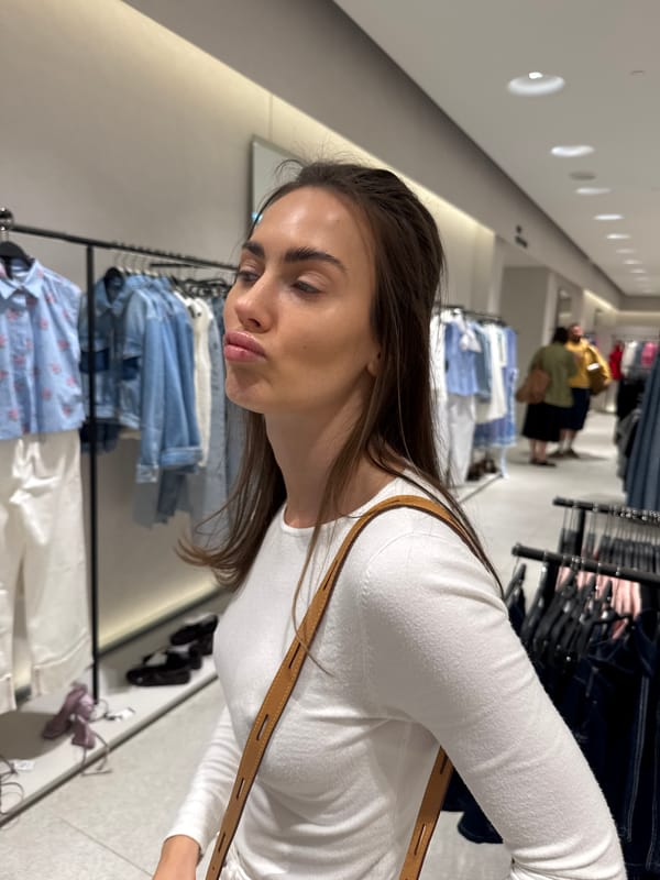 Woman shops for clothes, works at desk during afternoon