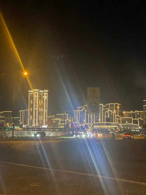Evening traffic flows through illuminated Stavropol streets