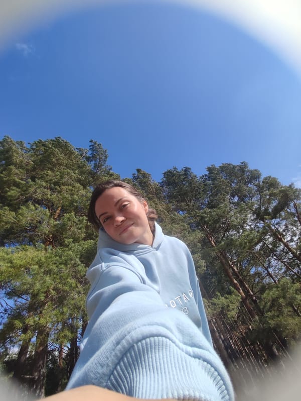 Young woman enjoys sunny spring morning in Russian village