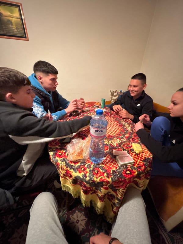Young men play cards in Goritsa, Bulgaria