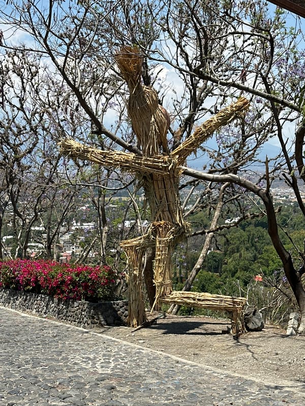 Straw figure and portrait captured at Atlixco scenic overlook