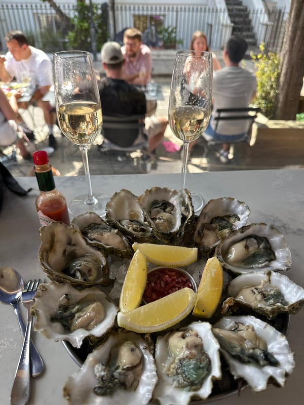 Londoners enjoy oysters and wine during outdoor dining gathering