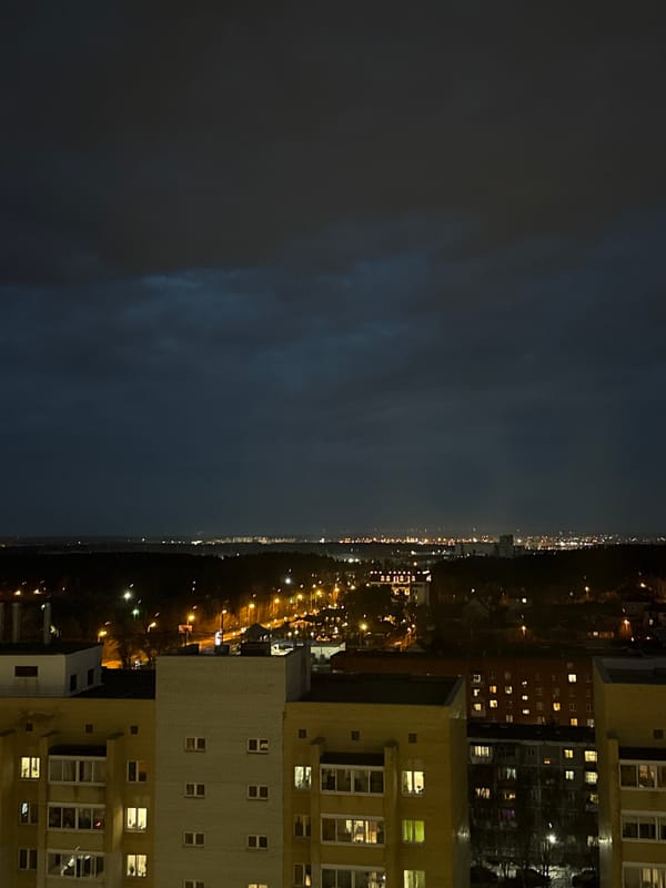 Night view of illuminated apartment building captured in Yekaterinburg