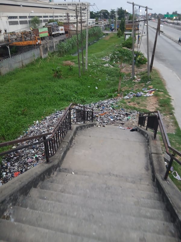 Urban infrastructure documented near highway and concrete steps