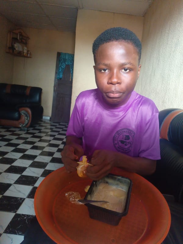 Family breakfast captured in Onitsha, Nigeria morning scene