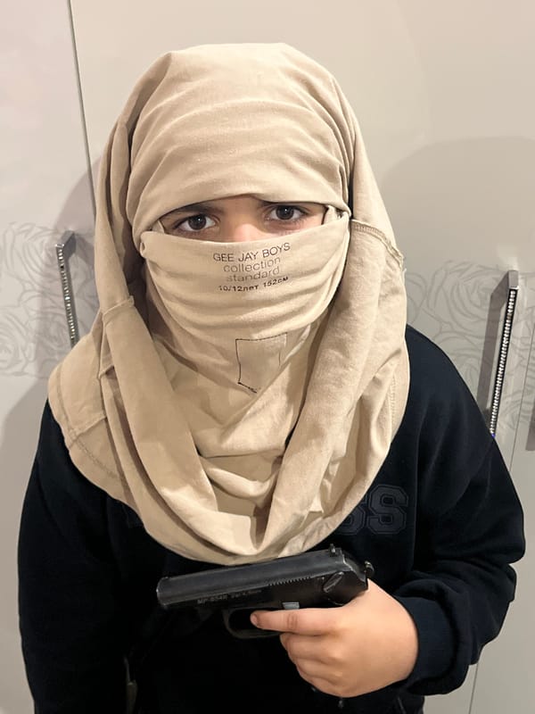 Posed indoor photos with toy guns and face coverings, Kostroma