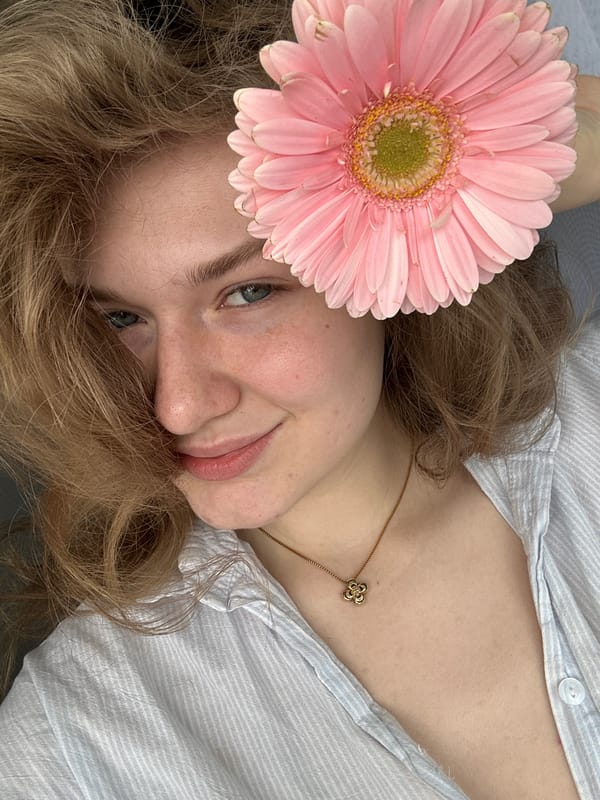 Woman poses with golden eye brooch in Kazan