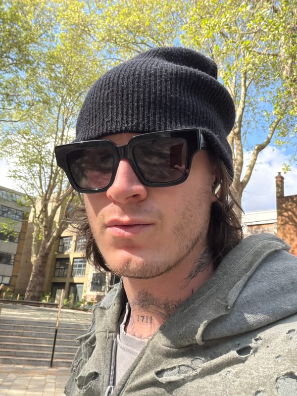 Young adult photographed outdoors in London on sunny afternoon