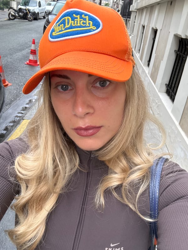 Woman in Orange Von Dutch Cap Photographed in Paris