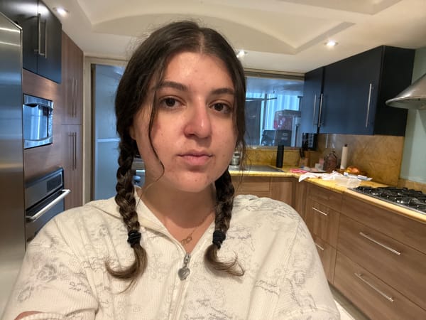 Woman in braided hair captured in kitchen moments, Mexico City