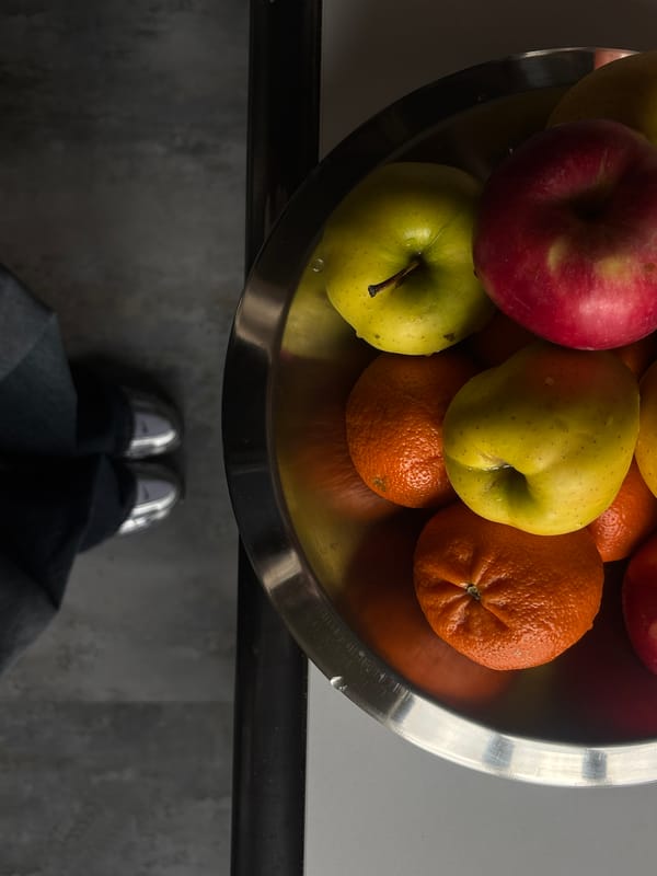 Still life arrangement with fruits and candles documented in Armenia
