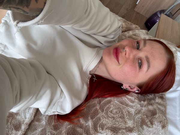 Red-haired woman photographed in casual indoor portraits, Rostov-on-Don