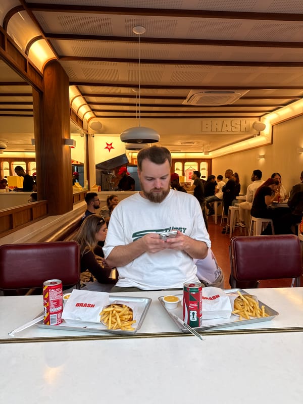 Restaurant workers cook hamburgers in Cape Town kitchen
