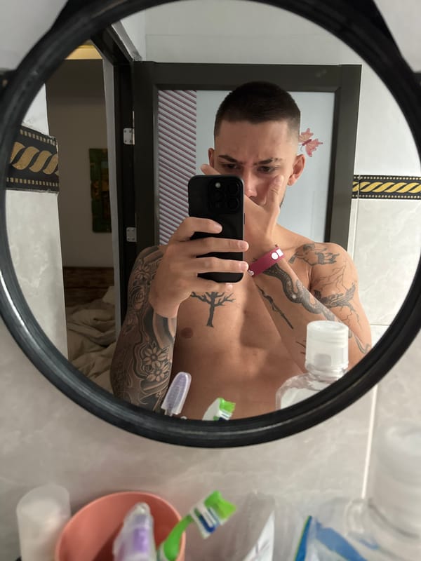Man takes bathroom mirror selfie in Munggu, Indonesia