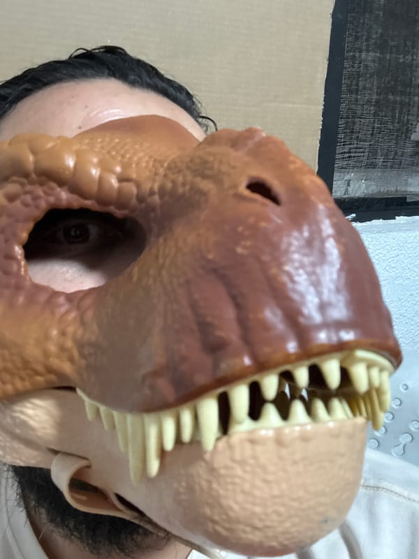 Costume sightings in Cuernavaca: dinosaur mask, clown poster observed
