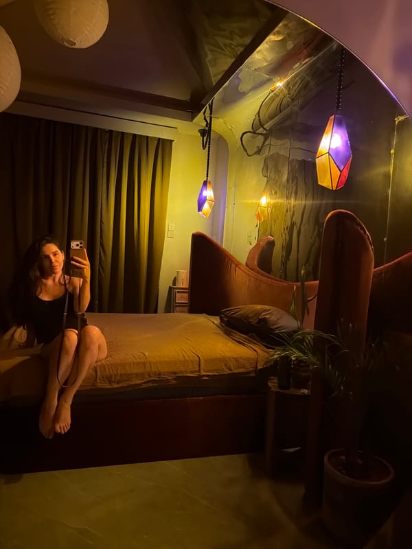 Woman takes selfies, lounges in bedroom in Mengwi