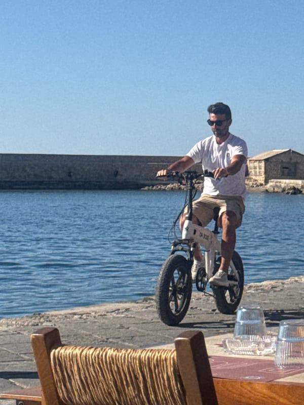 Afternoon leisure activity captured along Chania's Venetian harbor waterfront