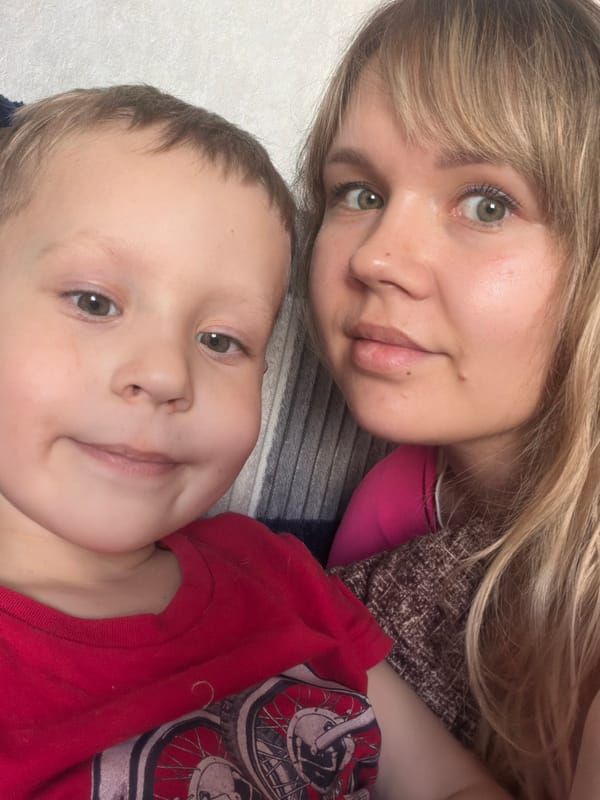 Two people captured in indoor selfie, April 25