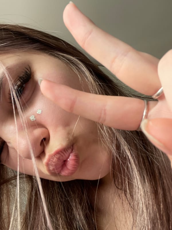 Woman photographed taking selfie, resting in Saint Petersburg bedroom