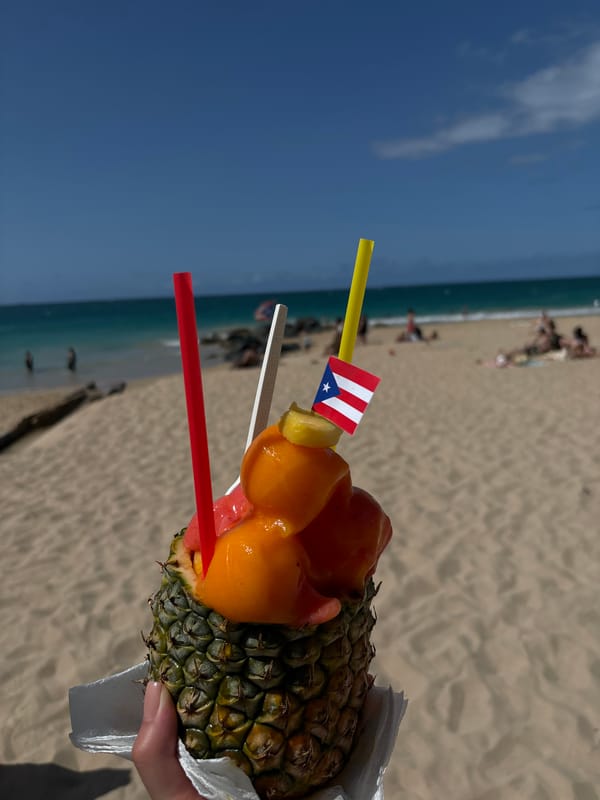 Pineapple fruit cups served fresh at a San Juan beach stand