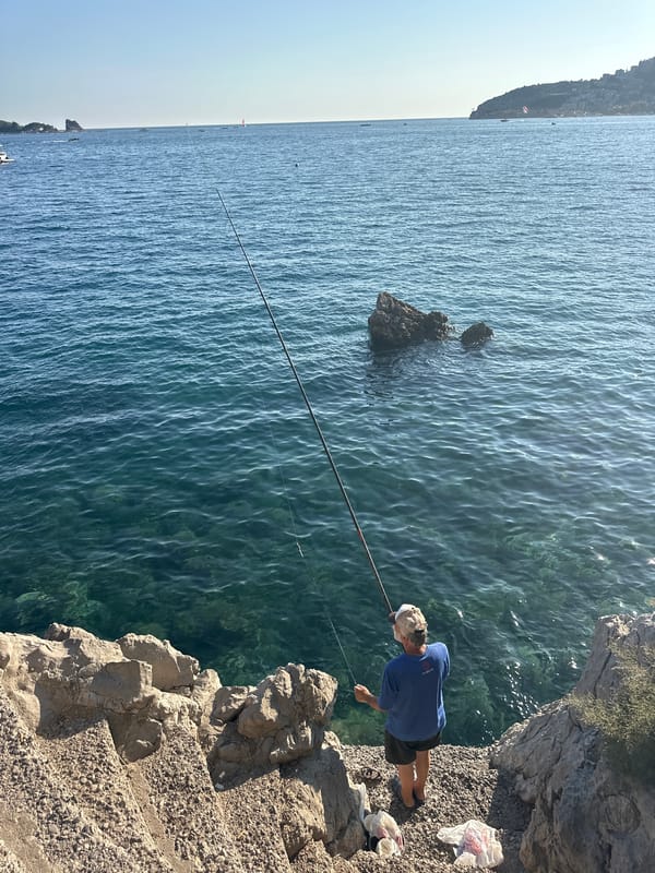Fishing and paddleboarding on Budva's Adriatic coast