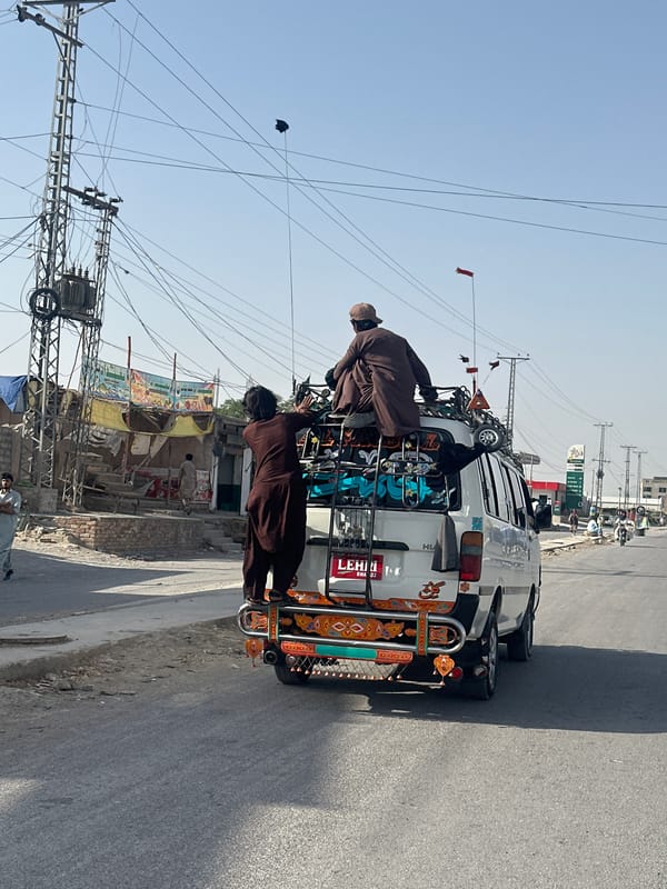 Passengers ride atop vehicles on Quetta streets early morning