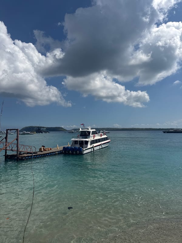 Sunny morning at Nusa Penida's harbor pier and lighthouse